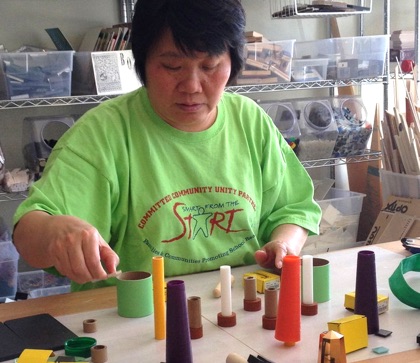 woman organizing different size and color cones