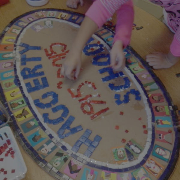 kids put together mosaic for Haggerty School anniversary