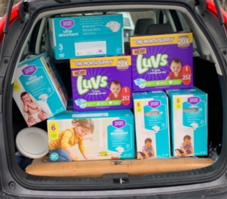 boxes of diapers in car trunk