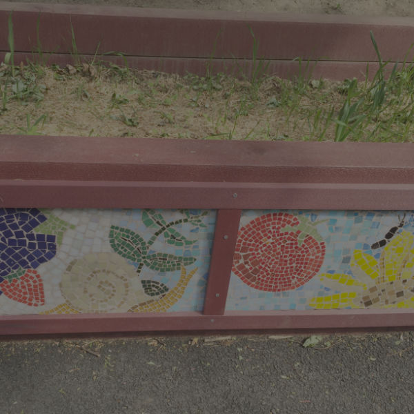 snail and flower mosaic on planter